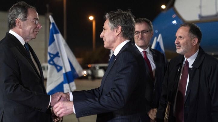 US Ambassador to Israel Thomas Nides (L) welcomes Secretary of State Antony Blinken, as Israel's Chief of State Protocol Gil Haskel (R) and Ministry of Foreign Affairs Deputy Director General David Roet look on at Ben Gurion Airport near Tel Aviv on March 26, 2022.